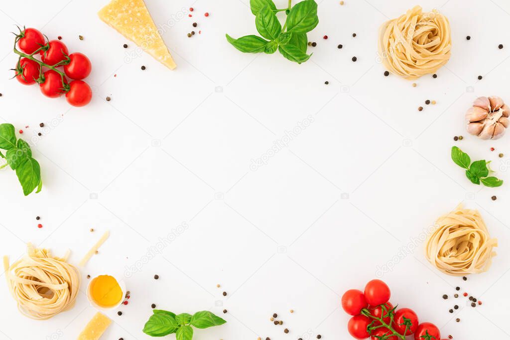 Frame of fettuccine with ingredients for cooking Italian pasta on white background, top view. flat lay