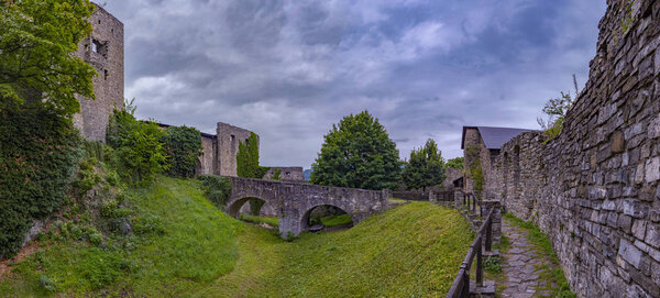 View of the inner courtyard and the moat of the Hukvaldy Castle in Hukvaldy, Moravian-Silesian Region, Czech Republic in the summer 2018