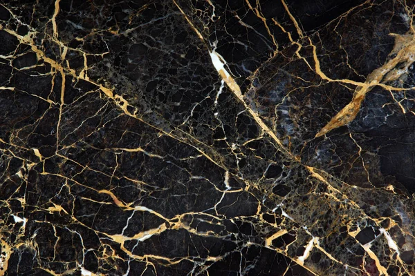 The surface of the slab of dark expensive marble with yellow and white veins is called New Portoro — Stock Photo, Image