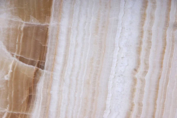 Piedra natural blanca con partes marrones, llamada ónix — Foto de Stock