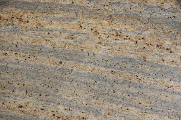 Background natural stone gray and beige with dark specks, called granite Juparano Colombo — Stock Photo, Image