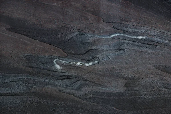 Cuarcita oscura de piedra natural con venas borgoña, llamada Rosso Luana — Foto de Stock