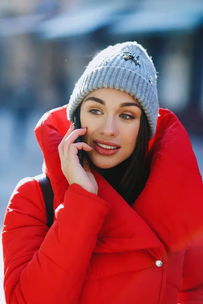 Happy Fashion Woman Using Smart Phone Talking Wearing Red Coat — Stock Photo, Image