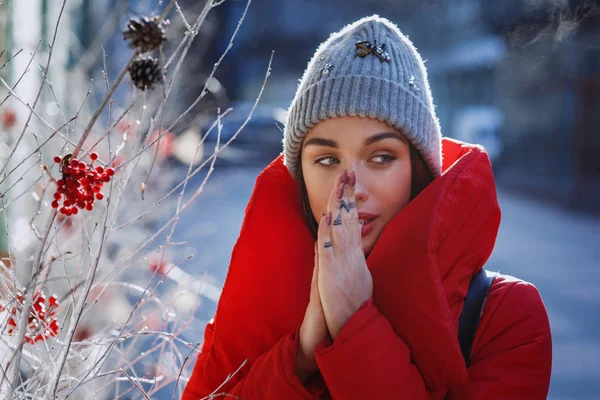 Girl Red Winter Jacket Tries Warm Herself Standing Street Covered — Stock Photo, Image