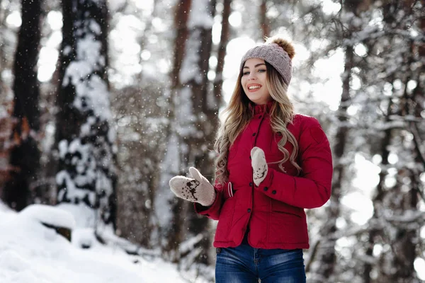 young beautiful smiling white tooth girl with amazing hair portrait wearing purple down jacket in winter snowy forest. Winter holiday concept - Image