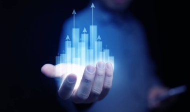 Elden yükselen parlak çubuk grafiği, veri analizi, yatırım büyümesi, ekonomik başarı, dijital dönüşüm ve fırsat gibi soyut iş ve teknoloji kavramları.