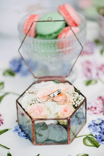 Still life brides morning, dish with cup of tea, champagne glass, wedding rings and flower bouquet