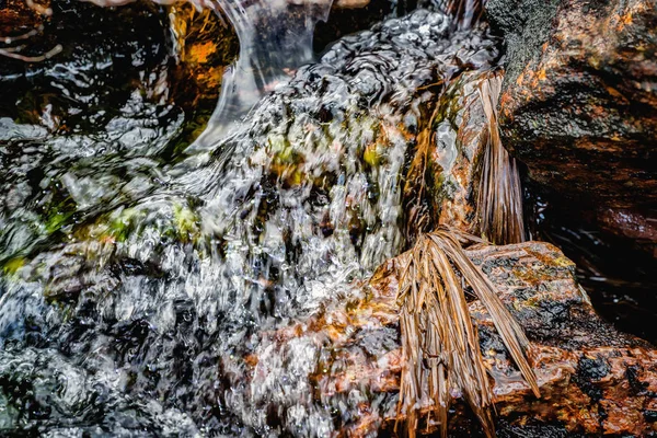 Stones in running water in a mountain river stream — Stock Photo, Image