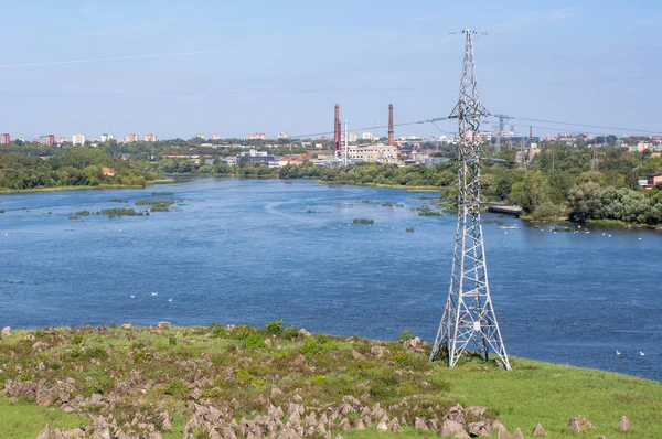 High voltage steel pole on the river bank — Stock Photo, Image