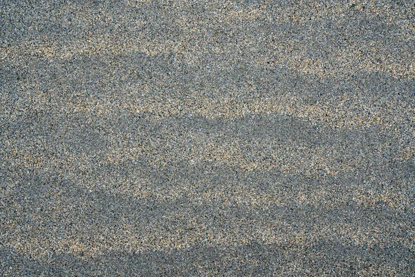 Gray sand surface for a background or texture — Stock Photo, Image