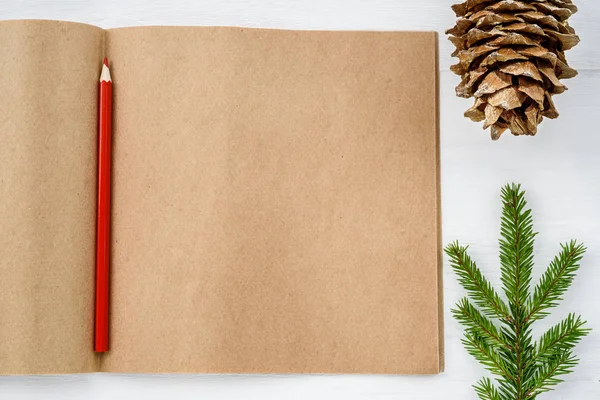 Notepad from paper craft and christmas tree on a white background.