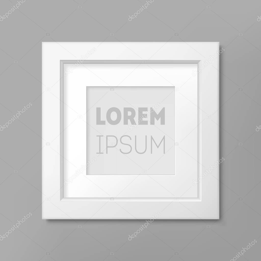 Realistic white square frame on gray wall background, border for your creative project presentation.