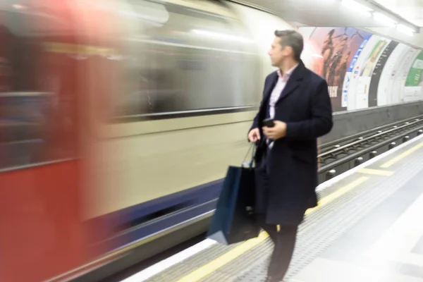 Blurred Commuters Using London Underground Train — Stock Photo, Image
