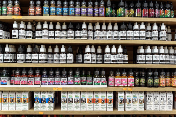 Rows of E-Liquids for Vaping on Display in a Shop