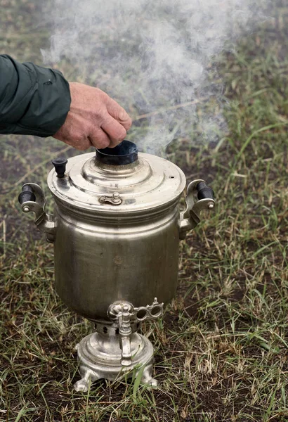 Russian Samovar and Human Male Hand