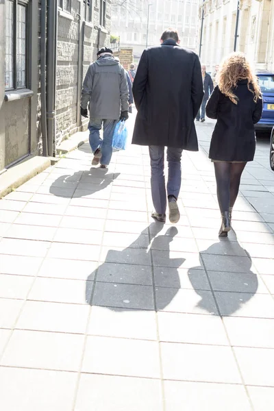 Man and Woman Walking Down Bright Street — Stock Photo, Image