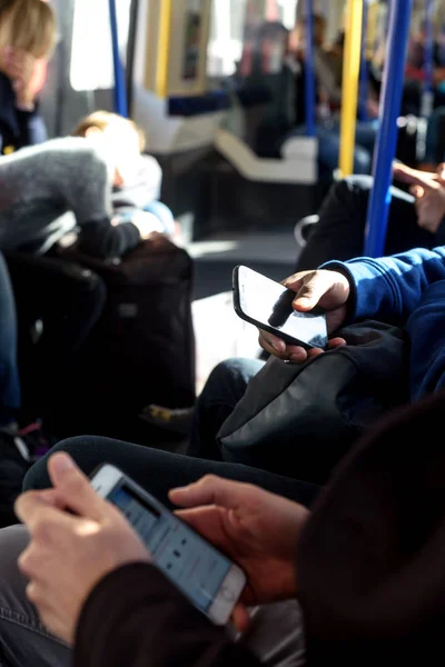 People Using Mobile Phone on London Underground Train — Stock Photo, Image