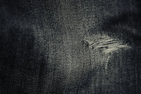 Getragene Jeans Loch in schwarz und weiß — Stockfoto