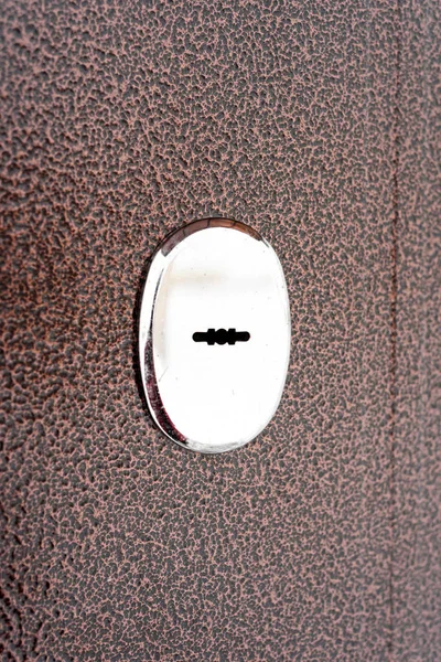Silver Keyhole Lock on a Brown Metal Door — Stock Photo, Image