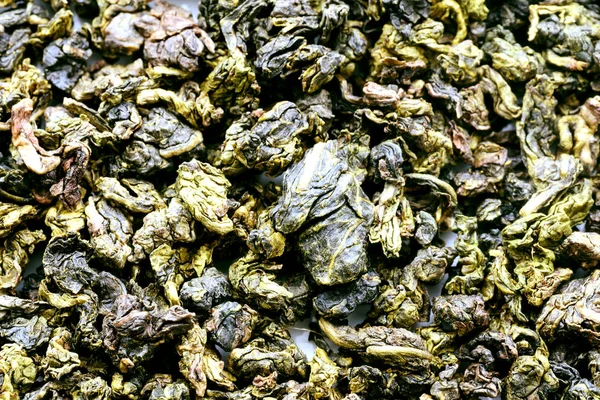 Крупный план чая из зеленых листьев — стоковое фото