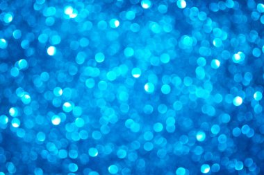 Odaklanmış arkaplan mavi parıltılı, ışıltılı bokeh