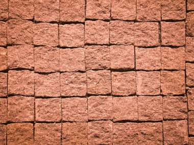 Doku: koyu kırmızı taş bloklar kaldırımda. Acımasız, vintage kaldırım