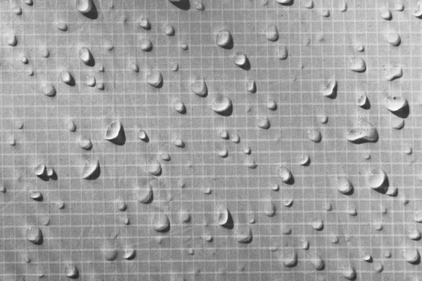 中性灰色纺织品上的大水滴 具有防水效果 防水浸渍 织物上的纹理掉落 — 图库照片