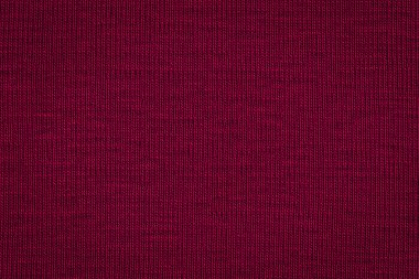 Abstract texture of a rough dark burgundy paper background and copy space for text. Macro fiber paper. clipart
