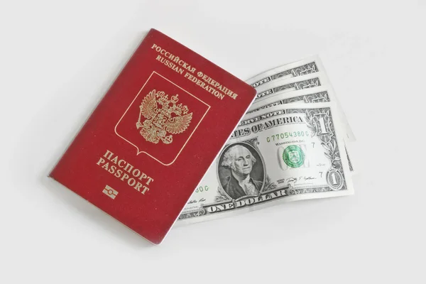Rosyjski Paszport Zagraniczny Leży Szczycie Jednego Dolara Rachunki Jasnym Tle — Zdjęcie stockowe