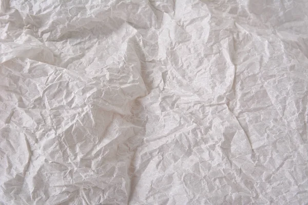 Textured clean sheet of crumpled paper white color empty background