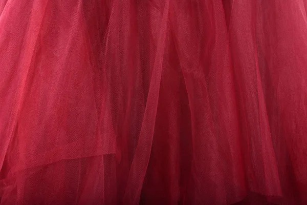 Fundo de textura tecido vermelho. A saia é feita de tule — Fotografia de Stock