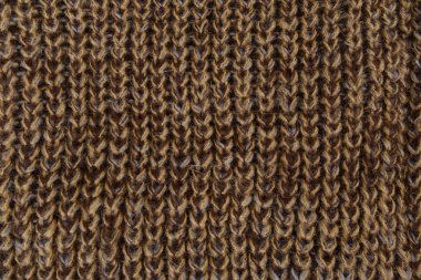 Kahverengi örme doku parçası. El yapımı kadın hobi