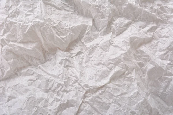 Textured clean sheet of crumpled paper white color empty background