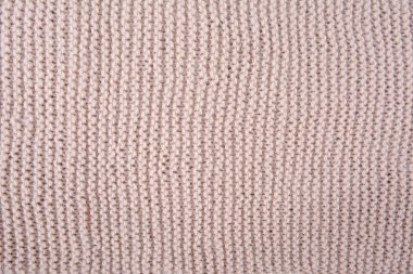 Bej örülmüş doku parçası. El yapımı kadın hobisi