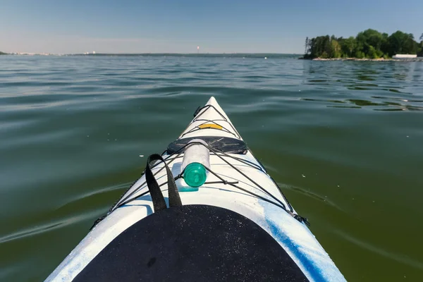 Kayak bow on the lake against the backdrop of the island