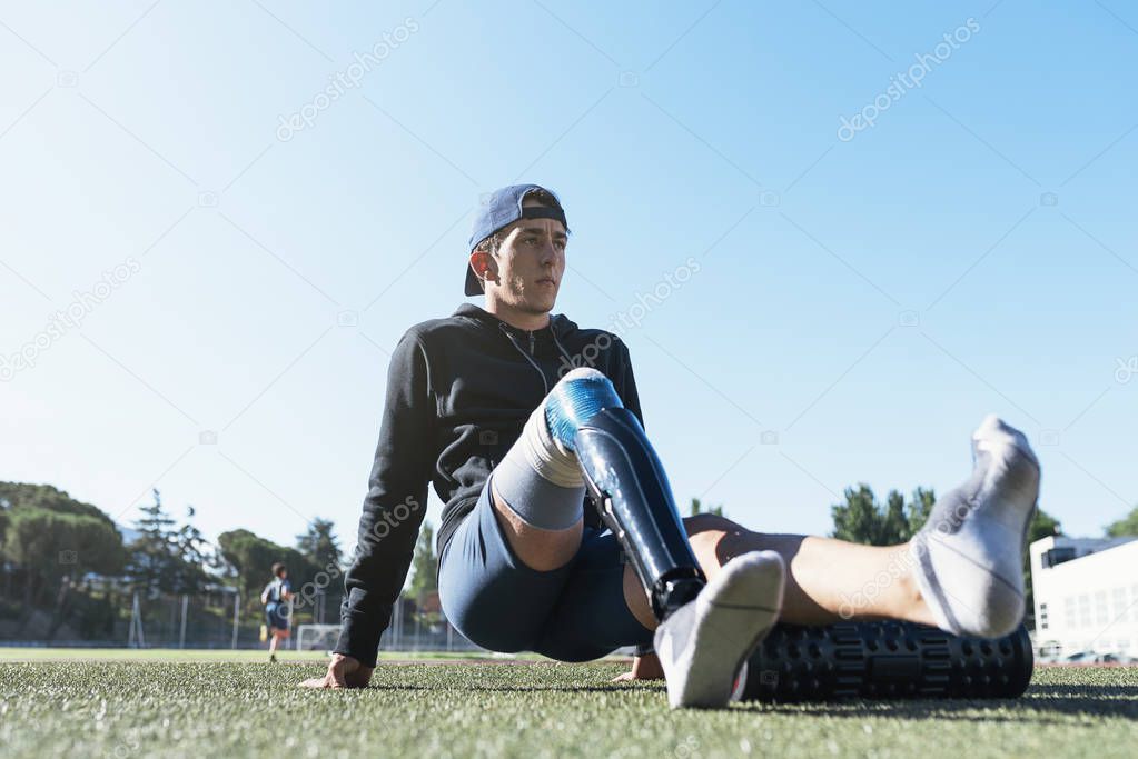 Portrait of disabled man athlete with leg prosthesis. Paralympic Sport Concept.