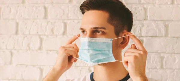 Panorama Banner Young Professional Doctor Putting Face Mask Protection Coronavirus — Stock Photo, Image