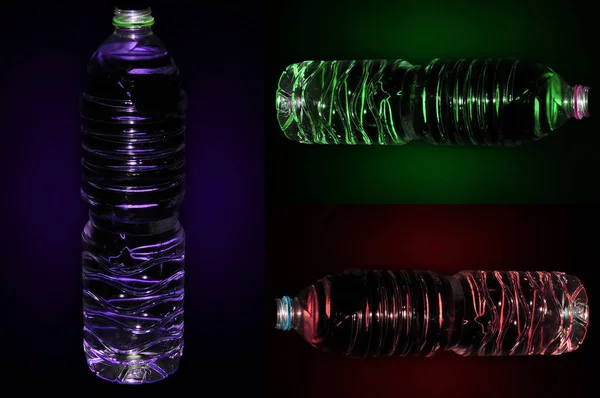 Siyah arka planda bir şişe şarap.