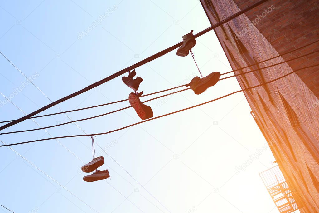 the image shoes hang on wires