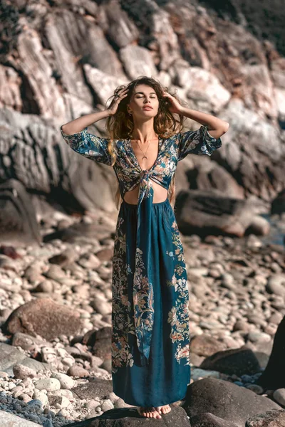 Beautiful young woman in stylish boho dress posing outdoors — Stock Photo, Image