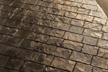 Damga beton doku deseninin ve arka plan ve katta güneş ışığı yansıması.