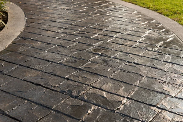 Damga beton doku deseninin ve arka plan ve katta güneş ışığı yansıması.