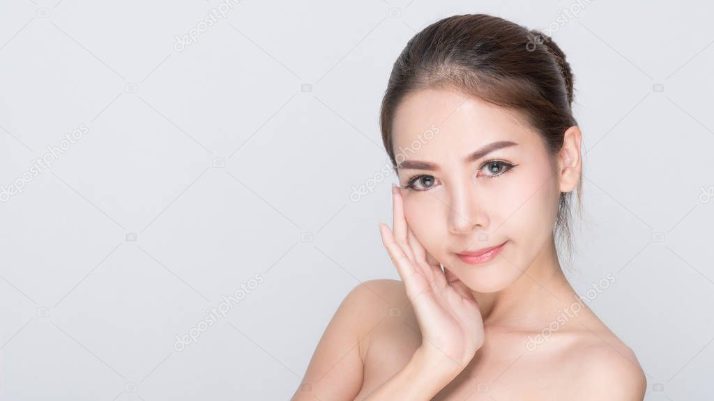Beautiful Young Woman(Asian girl 20-25 years old) with clean fresh skin in the mobile product sample box.