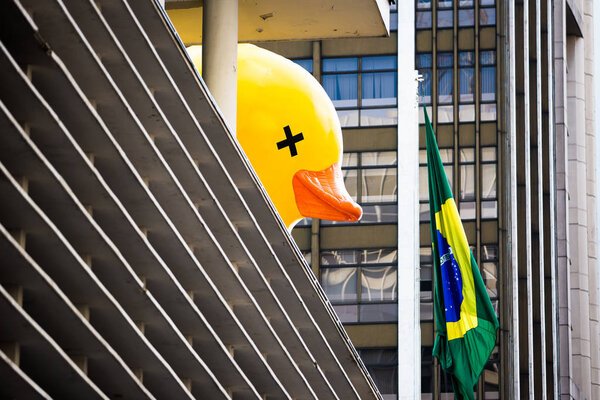 Sao Paulo, Brazil. Fruary 14, 2016. In Brazil, the duck symbolizes the people that pay the account of the corruptions of the politicians. The people deceived by the political class, who pays expensive taxes and has no return.