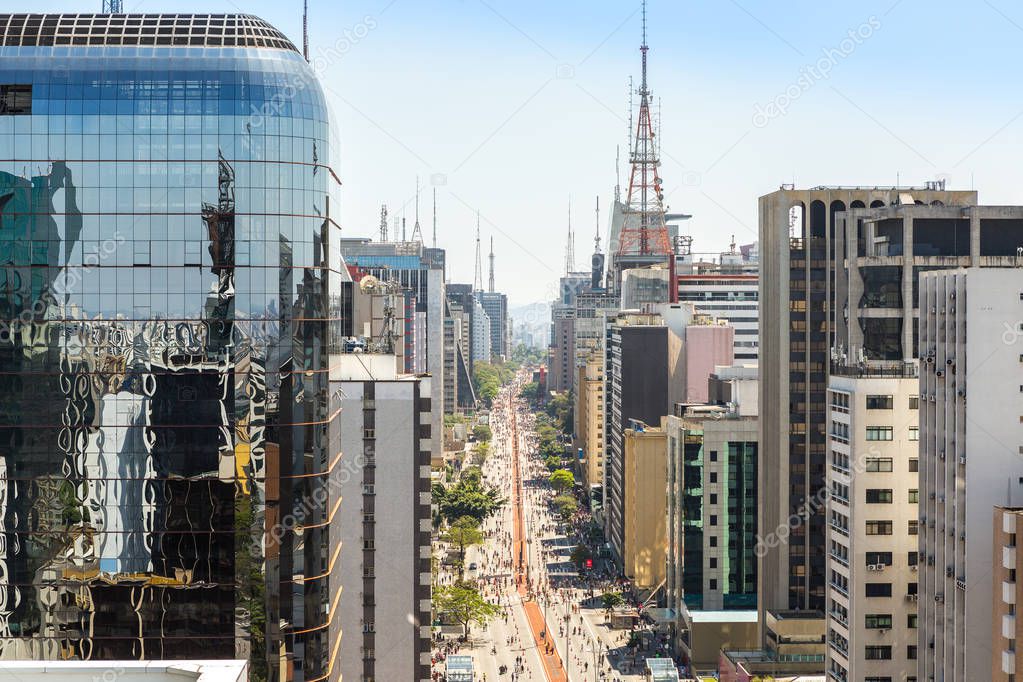 Aerial view of Avenida Paulista in Sao Paulo on a Sunday with a ban on cars, especially the bike path in the center of the avenue.