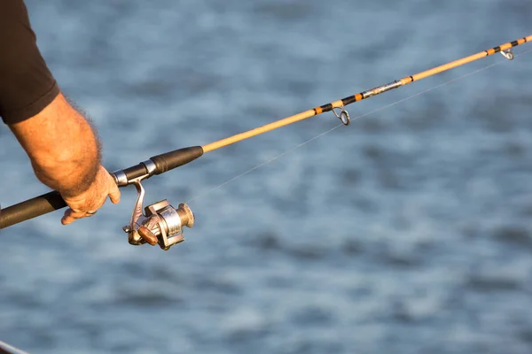 Man fishing in the late afternoon