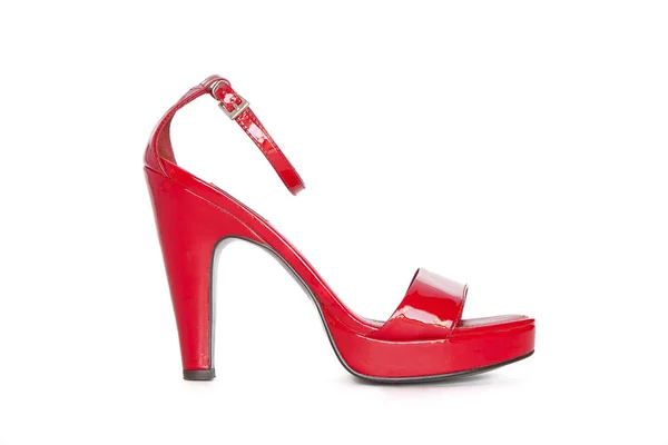 Red high-heeled women's shoe on a white background Royalty Free Stock Images