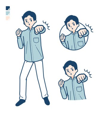 Ön planda yumruğu olan gömlekli bir adam.