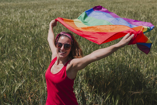 Woman Holding Gay Rainbow Flag Green Meadow Outdoors Happiness Freedom Royalty Free Stock Photos
