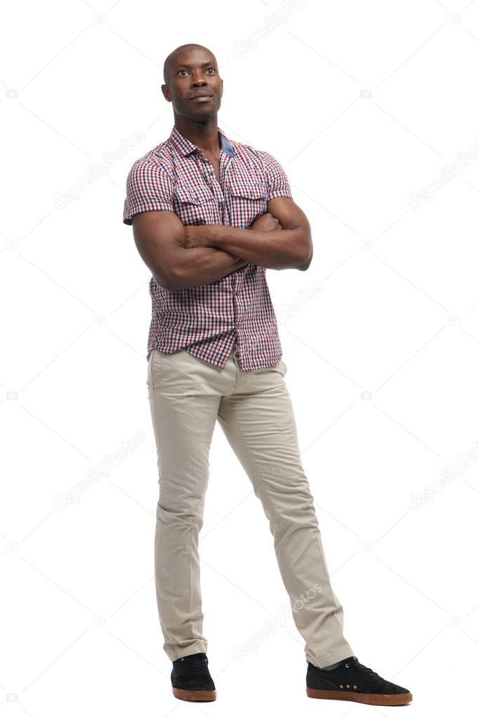 Cute black man in casual clothes in full length isolated on white background.